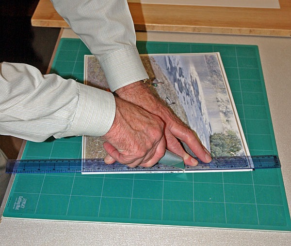 The mount card in this tutorial was cut to 20 by 16 inches. Never assume that your photograph or mount card is perfectly square. 3: Place your white backing card and your overlay together, in what will be the correct orientation. If necessary trim the edges to obtain a perfect match. 4: Trim the print back to its borders. See Figs. 01 and 02